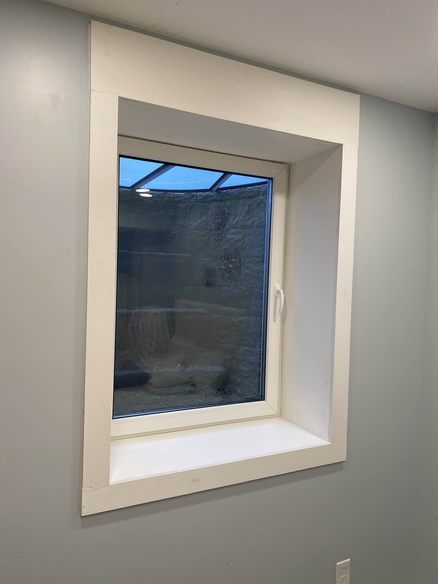 Completed basement egress window with well system