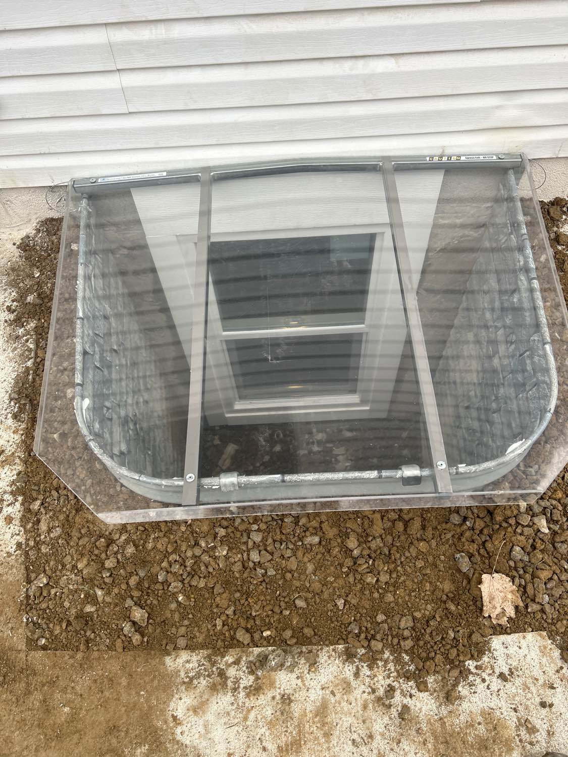 Egress window well installation — exterior view